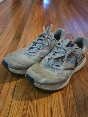 Nike Light Gray Running Shoes with Orange Eyelet Accents
